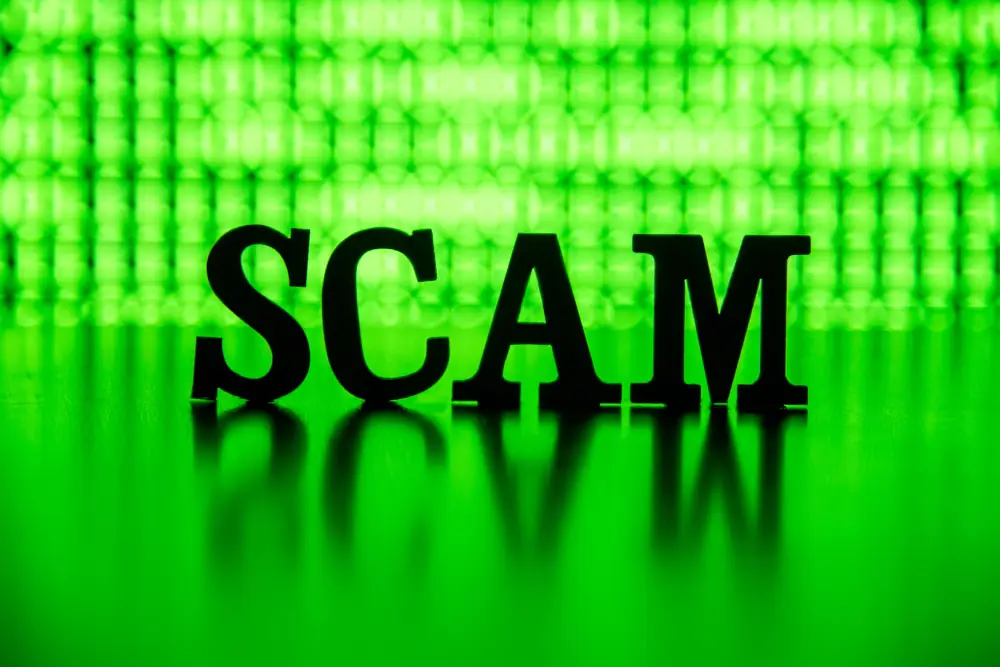 Navigating AC Repair Near Opelika, AL: Know the Scams and Protect Your Investment - Scam spelled out backlit by breen.