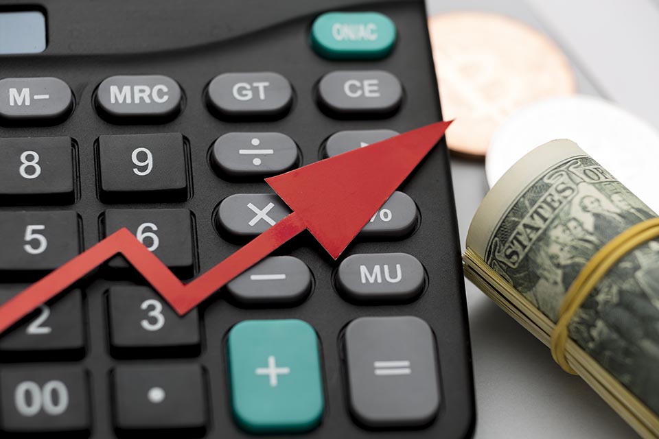 close up of calculator with a dollar